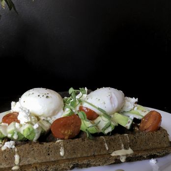 Nero Waffles - L'Avo - buckwheat brussels waffle, avocado, sesame dressing, garlic grape tomatoes, feta cheese, 2 poached eggs. - Desserts Near Me - Vancouver, British Columbia Nero Waffles - L'Avo - buckwheat brussels waffle, avocado, sesame dressing, garlic grape tomatoes, feta cheese, 2 poached eggs. - Desserts Near Me - Vancouver, British Columbia