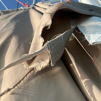 Dream Yacht Charter - Worn out mainsail cover - Boat Charters Near Me