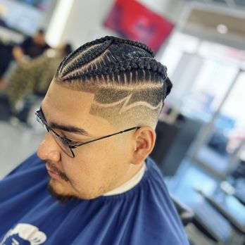 TopShelf Barbershop - Mimi fade with design. She braided his hair before the cut - Barbers Near Me - El Paso, Texas TopShelf Barbershop - Mimi fade with design. She braided his hair before the cut - Barbers Near Me - El Paso, Texas