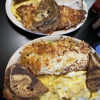 Hungry Hunter Restaurant - Stuffed hash browns, omelet, pork tenderloin smothered in gravy and homemade rye toast! - Breakfast & Brunch Near Me - Branson, Missouri