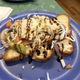 Ruby Sue (poached eggs, avocado, tomatoes, red onion, mozzarella and balsamic glaze on top of gluten free bread) Ruby Sue (poached eggs, avocado, tomatoes, red onion, mozzarella and balsamic glaze on top of gluten free bread)