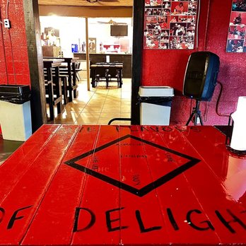 Konan BBQ - a red table with a sign on it - Barbeque Near Me - Tampa, Florida