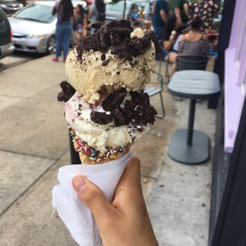 Bmore Licks - Milk/cereal with white chocolate raspberry cheesecake and Oreo crumbles in a dipped waffle cone - Ice Cream & Frozen Yogurt Near Me - Baltimore, Maryland Bmore Licks - Milk/cereal with white chocolate raspberry cheesecake and Oreo crumbles in a dipped waffle cone - Ice Cream & Frozen Yogurt Near Me - Baltimore, Maryland