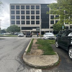 Baptist Health Emergency Care -  Louisville - Take your pick. Walk in the road of a really busy parking lot,or on this mud path. Baptist Health please install walkway!
