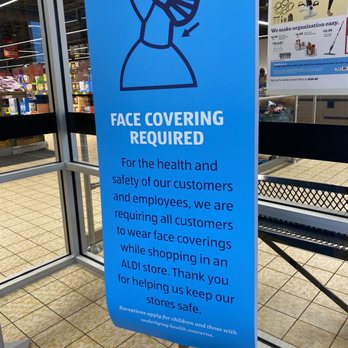 ALDI - a face covering required sign in a store - Grocery Near Me - Melbourne, Florida