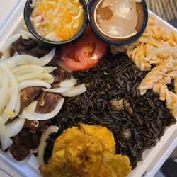 Le Bistro 2.0 - Griot complete; lots of bones and dried out meat for $34 dollar plate! Rice was ok, but bland in flavor. Best part tostones and pasta salad.
