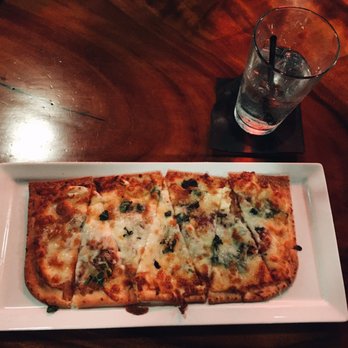 O'Bricks - this is the white flat bread. (5 different cheeses.) yum.  great as an appetizer or for a light main course. - New American Near Me - Bradenton, Florida