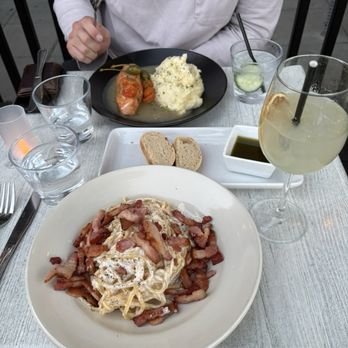 Monello - Cheese wheel pasta with bacon and Salmon Piccata and limoncello spritz - Italian Near Me - San Diego, California Monello - Cheese wheel pasta with bacon and Salmon Piccata and limoncello spritz - Italian Near Me - San Diego, California