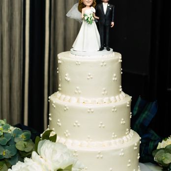 Passion Bakery Cafe - a wedding cake with a bride and groom figurine - Bakeries Near Me - Ashton-Sandy Spring, Maryland Passion Bakery Cafe - a wedding cake with a bride and groom figurine - Bakeries Near Me - Ashton-Sandy Spring, Maryland