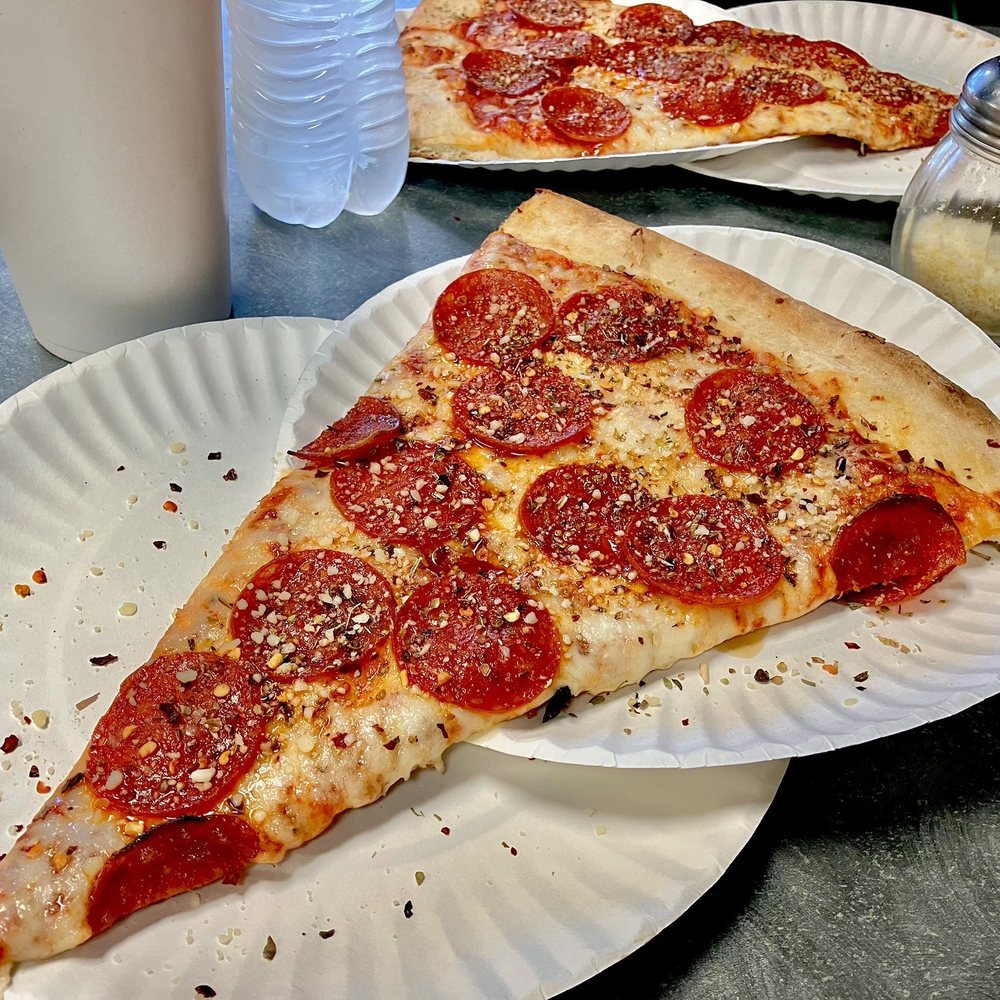 a slice of pepperoni pizza a slice of pepperoni pizza