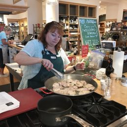 a woman preparing food in a kitchen a woman preparing food in a kitchen