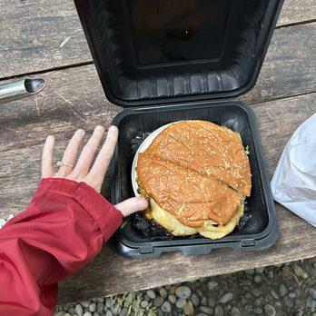 Sully's Drive-In - 12th man burger. Hand for reference. - Fast Food Near Me - Forks, Washington