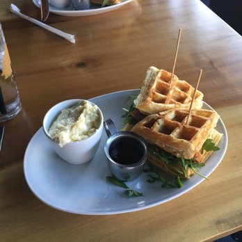 Parkside Restaurant - Chicken and waffle sandwich with a side of cheese grits!!! - American Near Me - Raleigh, North Carolina