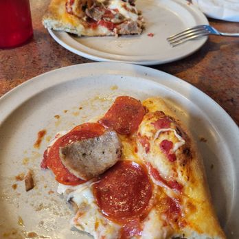 Giuseppe's Italian Restaurant - Part of a Piece of Pepperoni, Sausage, Mushroom Pizza. - Italian Near Me - Fellsmere, Florida Giuseppe's Italian Restaurant - Part of a Piece of Pepperoni, Sausage, Mushroom Pizza. - Italian Near Me - Fellsmere, Florida