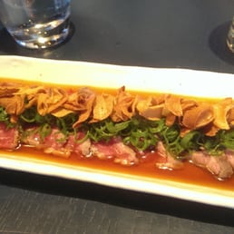 Beef tataki with onion ponzu sauce and garlic crisps