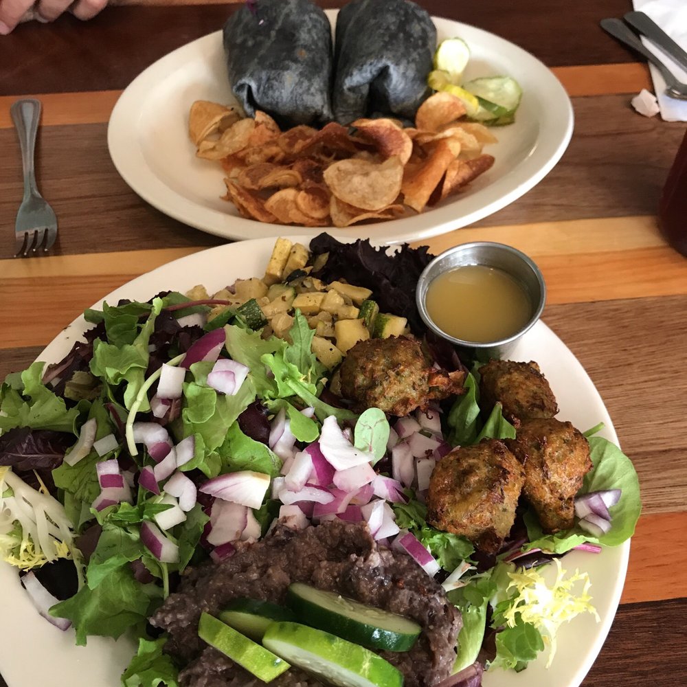 Falafel salad and signed wrap. Falafel salad and signed wrap.