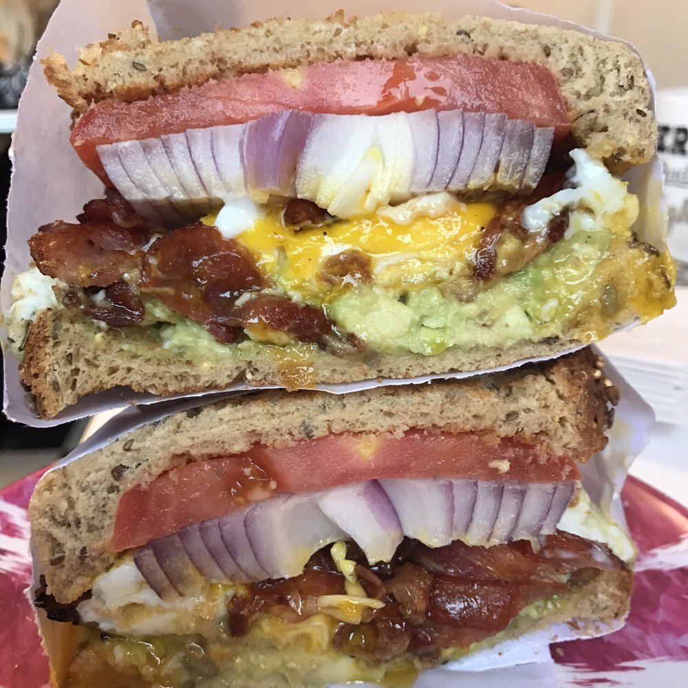 Crazy Beans - My custom egg sandwich. 3 eggs over easy, bacon, grilled chicken, avocado, raw onion, tomato, on multigrain - Breakfast & Brunch Near Me - Greenport, New York Crazy Beans - My custom egg sandwich. 3 eggs over easy, bacon, grilled chicken, avocado, raw onion, tomato, on multigrain - Breakfast & Brunch Near Me - Greenport, New York