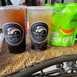 two cups of iced tea on a wicker table