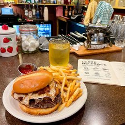 Breakfast burger with bacon, egg, and hashbrown and side of crispy fries Breakfast burger with bacon, egg, and hashbrown and side of crispy fries