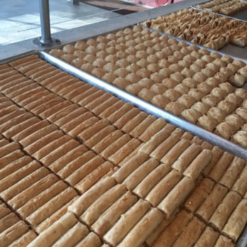 Nizam Pastry - a variety of pastries on a conveyor belt - Bakeries Near Me - Dearborn, Michigan