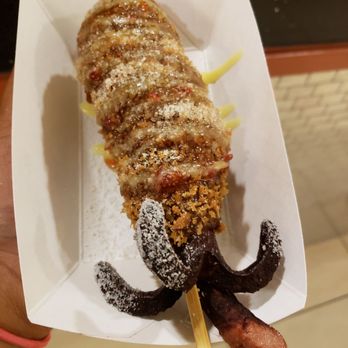 Mr.Cow-Ala Moana - Squid ink mozzarella hotdog! Has sugar coated around the tentacles and the crust. - Hot Dogs Near Me - Honolulu, Hawaii