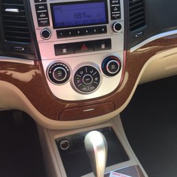 Gear shift & radio. Area in front of gear shift was disgusting - melted cough drops and hard candy. Sticky & dirty.