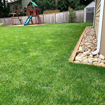 DS Pro Deck and Fence - Installed play area with wood chips and rock next to house. - Landscaping Near Me