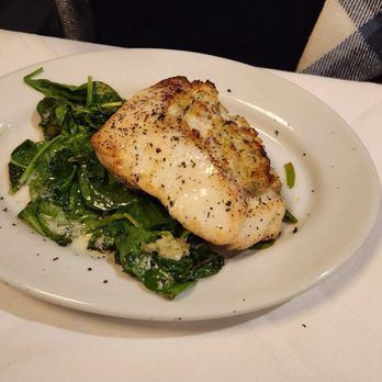 Ruth's Chris Steak House - GARLIC CRUSTED SEA BASS - Steakhouses Near Me - Lake Grove, New York Ruth's Chris Steak House - GARLIC CRUSTED SEA BASS - Steakhouses Near Me - Lake Grove, New York