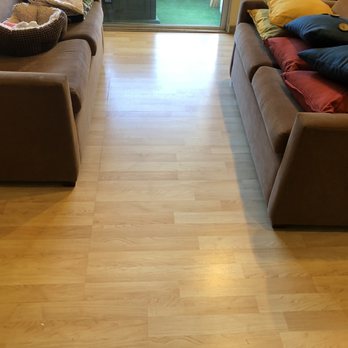 IZ Flooring - This is the "before" photo of the living room with the outdated laminate floor. - Flooring Near Me - San Diego, California