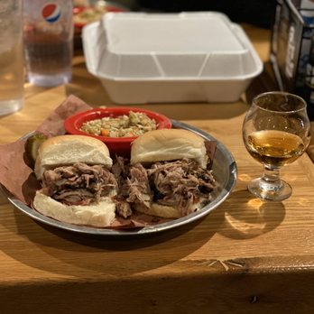 Doc's Commerce Smokehouse - BBQ Pulled Pork Sliders paired with a spicy, hot slaw and Central Standard Craft Distillery Bourbon made here in Milwaukee. - Barbeque Near Me - Milwaukee, Wisconsin