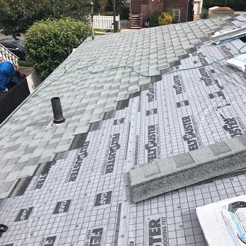 Luigi's Home Improvement - the roof of a house with a new roof - General Contractors Near Me Luigi's Home Improvement - the roof of a house with a new roof - General Contractors Near Me
