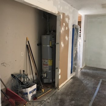 Water Heaters Masters - Removing a large water heater from inside the house. - Water Heater Installation/Repair Near Me - Concord, California Water Heaters Masters - Removing a large water heater from inside the house. - Water Heater Installation/Repair Near Me - Concord, California