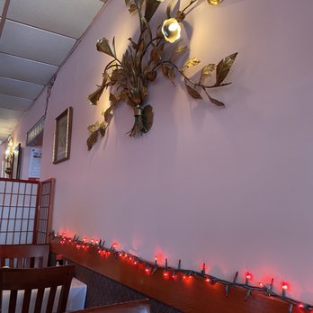 So Far So Good - a dining room with candles and a clock on the wall - Chinese Near Me - Lynbrook, New York So Far So Good - a dining room with candles and a clock on the wall - Chinese Near Me - Lynbrook, New York
