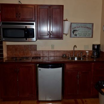 Lure Me Inn - Roomy kitchen area. Pots and pans and dishes all included. Two-burner stove. - Hotels Near Me - Ennis, Montana Lure Me Inn - Roomy kitchen area. Pots and pans and dishes all included. Two-burner stove. - Hotels Near Me - Ennis, Montana