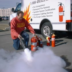 Mazzy's Fire Protection Specialists - Servicing a fire extinguisher