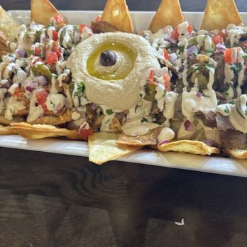 Kraving Kebab Pizza - Half gyro and half chicken Mediterranean Nachos - Pizza Near Me - Turlock, California Kraving Kebab Pizza - Half gyro and half chicken Mediterranean Nachos - Pizza Near Me - Turlock, California