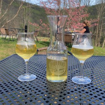 Potter's Craft Cider - three glasses of cid on a table - Cideries Near Me - Charlottesville, Virginia