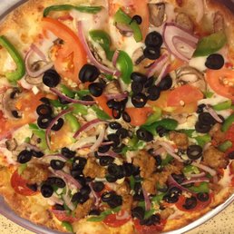 Half veggie and half supreme pizza Half veggie and half supreme pizza