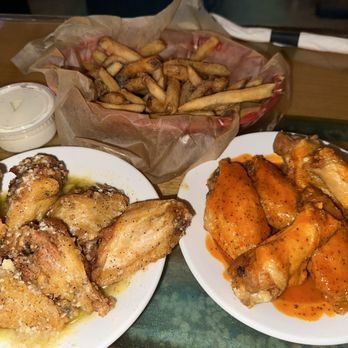 The Crooked Paddle - Pymatuning Wings and Hot Wings with a basket of fries - Pubs Near Me - Linesville, Pennsylvania