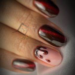 Lacquer Nails & Spa - Bold chrome cat-eye nails with snake accent