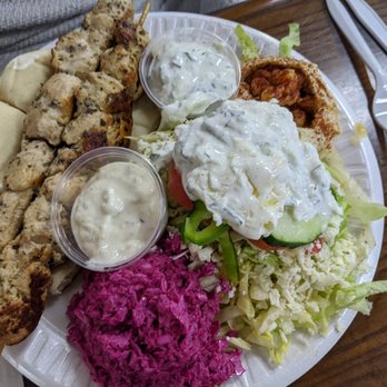 Nazareth Bread - Double Andalusian chicken platter with hummus, salad (tzaziki dressing), and slaw - Mediterranean Near Me - Greensboro, North Carolina Nazareth Bread - Double Andalusian chicken platter with hummus, salad (tzaziki dressing), and slaw - Mediterranean Near Me - Greensboro, North Carolina
