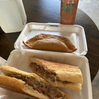 Cachucha & Swine - Mojo Pork sandwich, chicken empanada, and Jupiña pineapple soda. - Food Trucks Near Me - Land O' Lakes, Florida