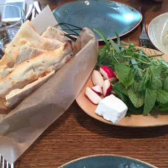 Rumi's Kitchen - Naan bread& free condiments - olives, nuts, cheese, mint, tarragon.  Nice touch that beats salt & pepper any day! - Persian/Iranian Near Me - Atlanta, Georgia