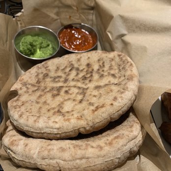 Oren's Hummus - Pita bread & spicy cilantro sauce & a tomato based sauce - Mediterranean Near Me - San Francisco, California