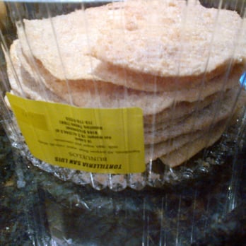 Tortilleria San Luis - a stack of tortillas wrapped in plastic - Mexican Near Me - Houston, Texas Tortilleria San Luis - a stack of tortillas wrapped in plastic - Mexican Near Me - Houston, Texas