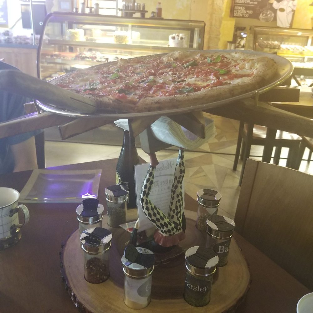 AmberDonia Bakery - Cute stand for the fresh out of the oven hot pizza!! - Bakeries Near Me - Kingston, Pennsylvania