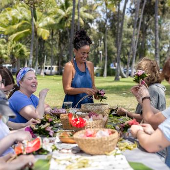 Eco Mindful Lei - Gina teaching her lei making workshops. Photography by Oshi Simpson Photography - Flowers & Gifts Near Me Eco Mindful Lei - Gina teaching her lei making workshops. Photography by Oshi Simpson Photography - Flowers & Gifts Near Me