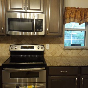 Victor's Tile Plus - a kitchen with stainless steel appliances - Flooring Near Me - Bunnell, Florida