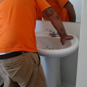 West Coast Flooring Center - Plumber fixing the separated sink and piping caused by wood laminate installers - Flooring Near Me - Temecula, California West Coast Flooring Center - Plumber fixing the separated sink and piping caused by wood laminate installers - Flooring Near Me - Temecula, California