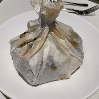 The Heritage Restaurant - a bag of food on a plate - New American Near Me - Grand Rapids, Michigan The Heritage Restaurant - a bag of food on a plate - New American Near Me - Grand Rapids, Michigan